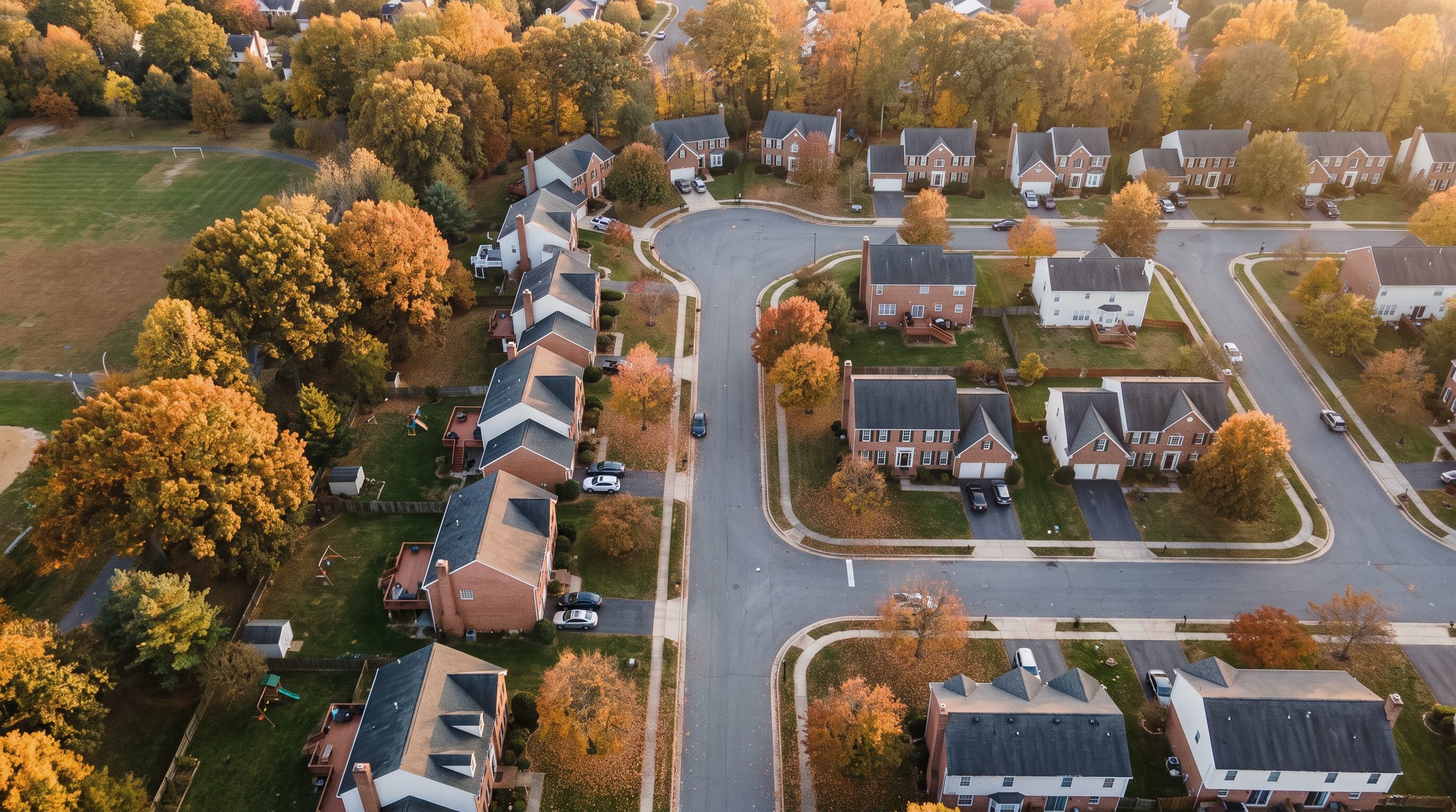 Aerial view of a Maryland suburban neighborhood in autumn at golden hour